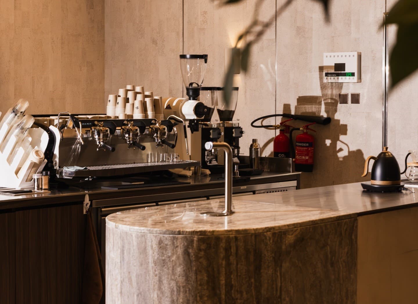 The marble bar and espresso machine at Puzzle Coffee