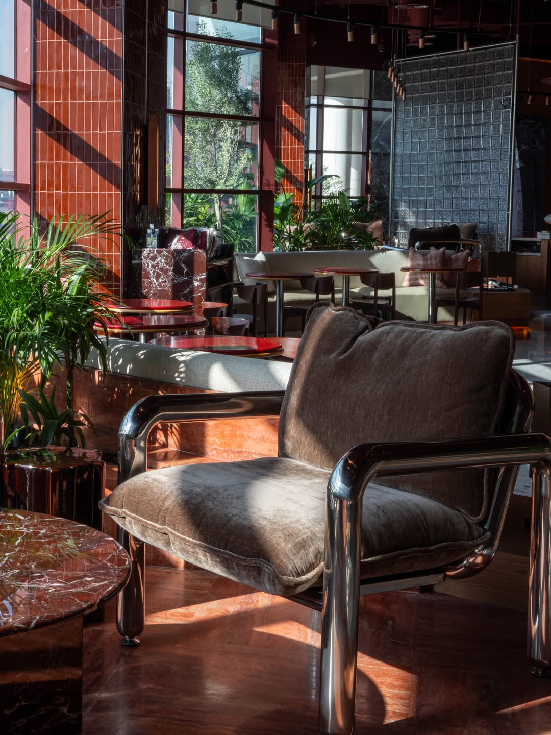 A silver teapot and croissant at Cherry House
