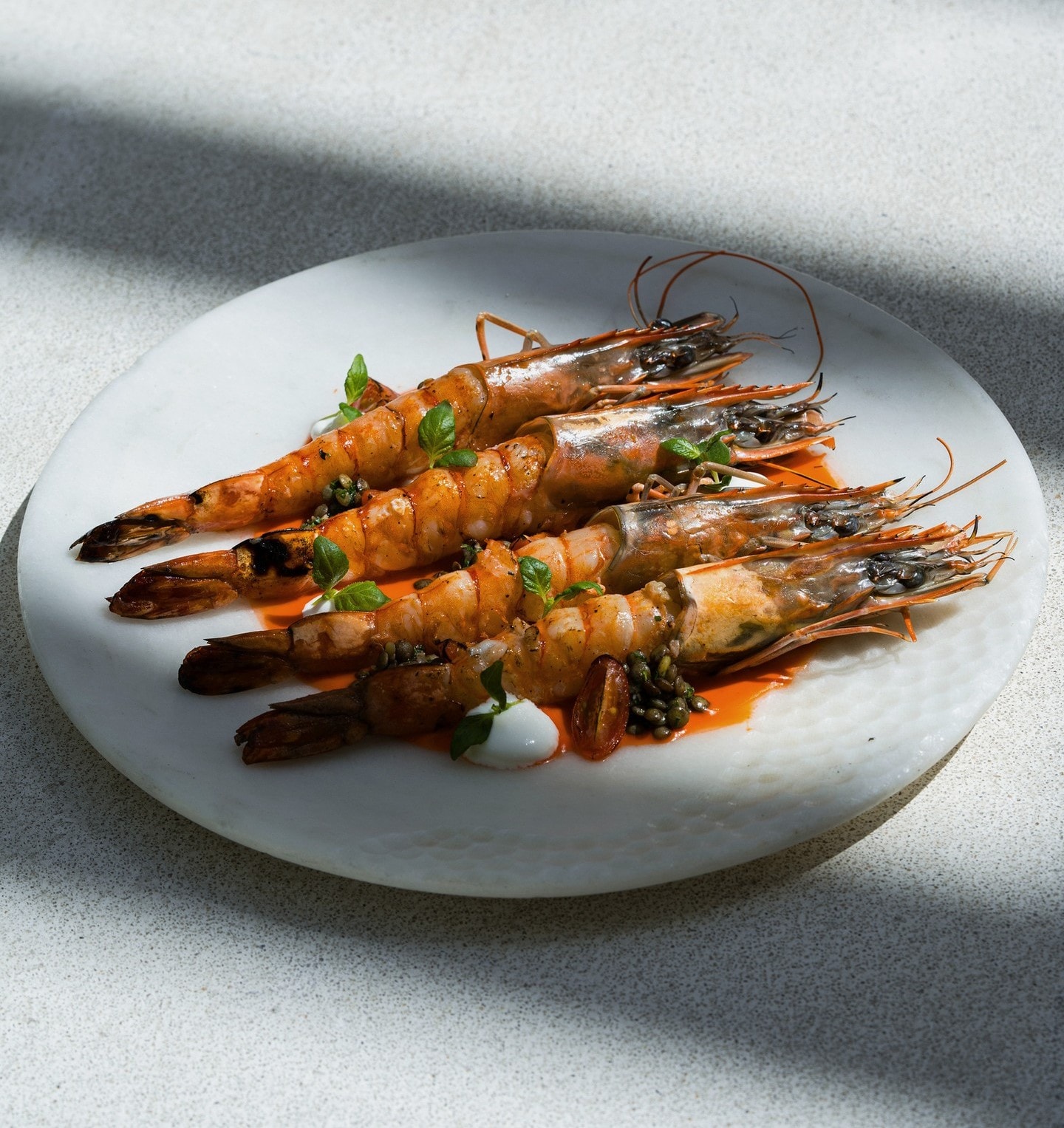 Grilled prawns plated at SĀN Beach