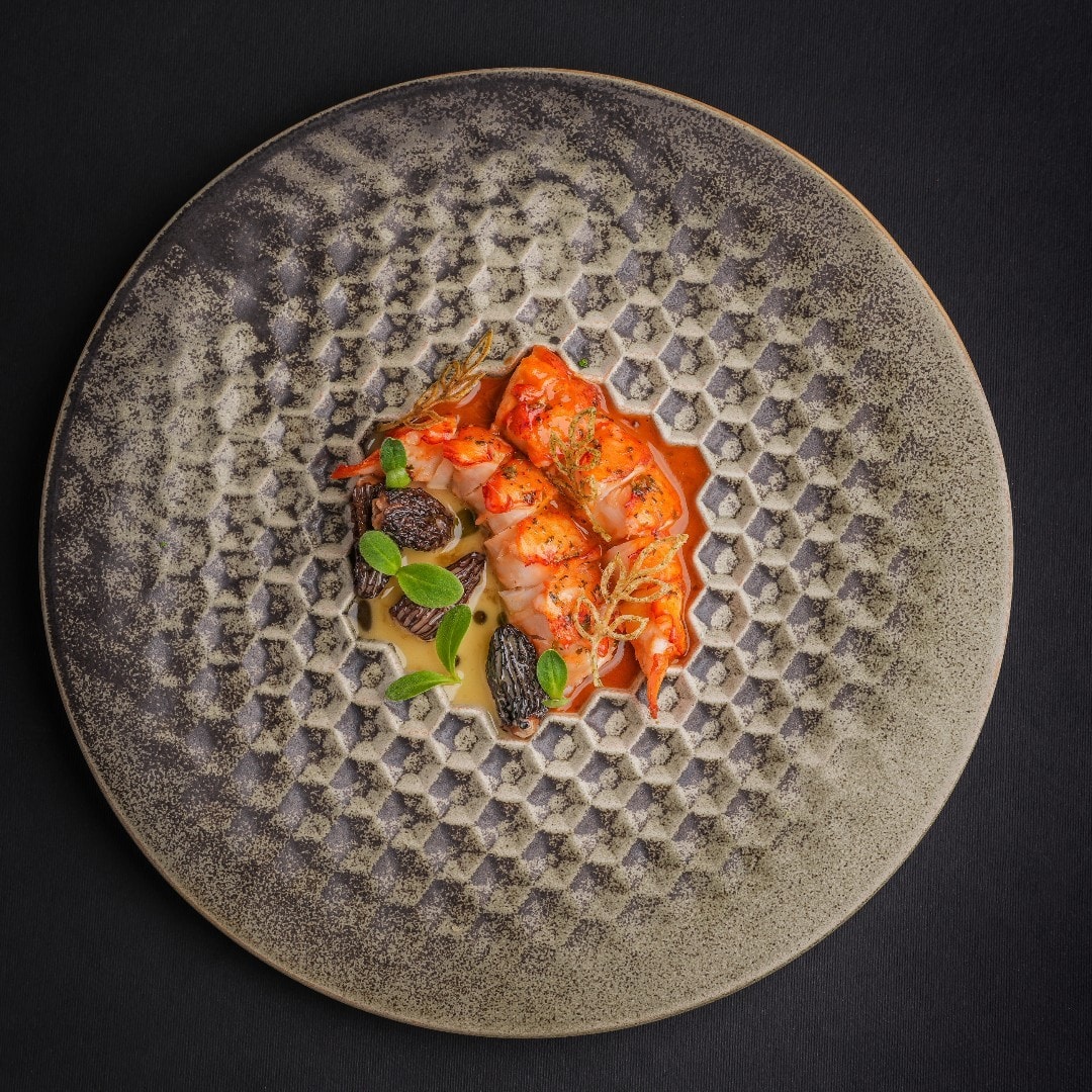 Salmon crudo on ice at UCHI