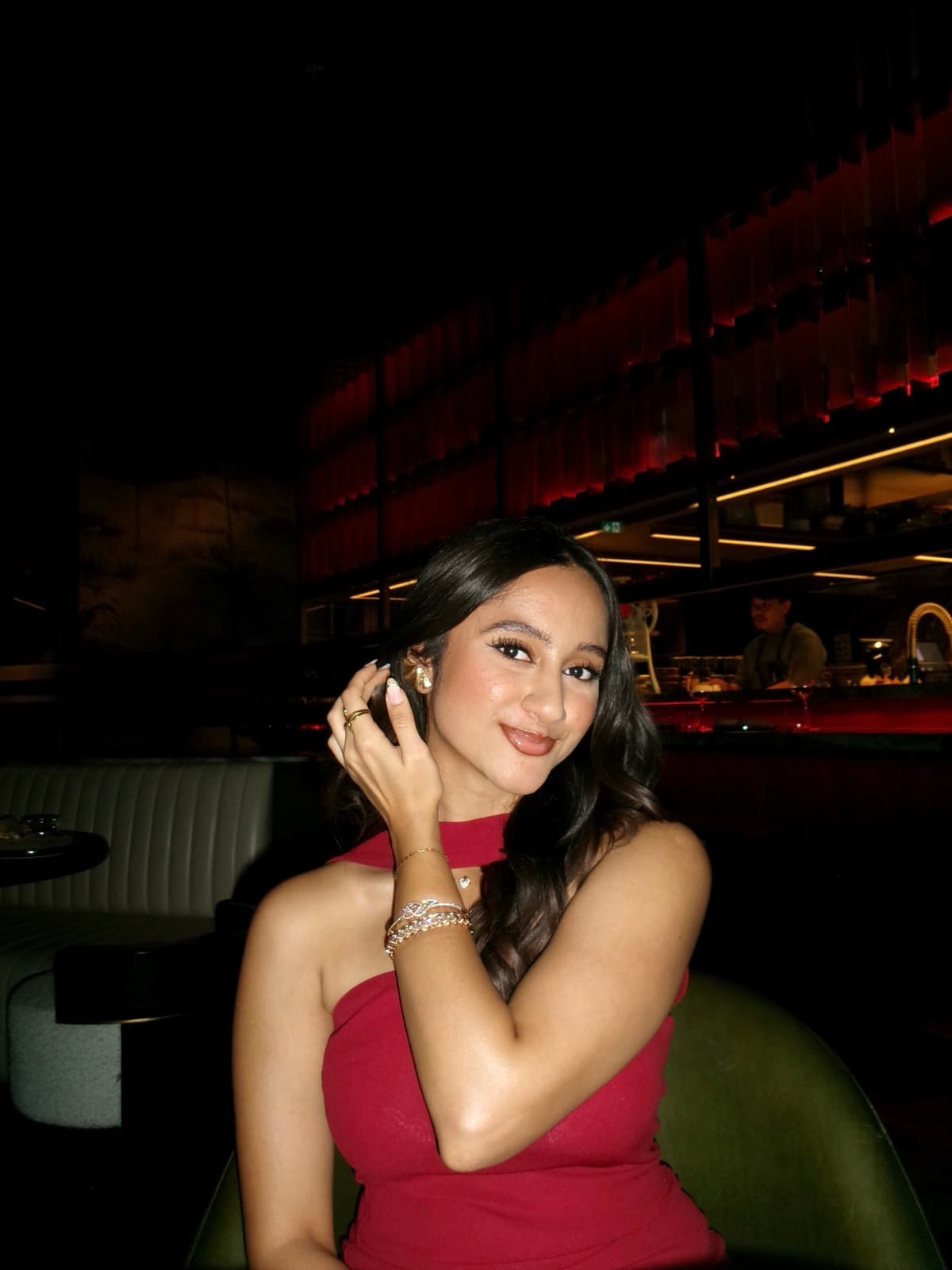 Nikita out for dinner in a red dress