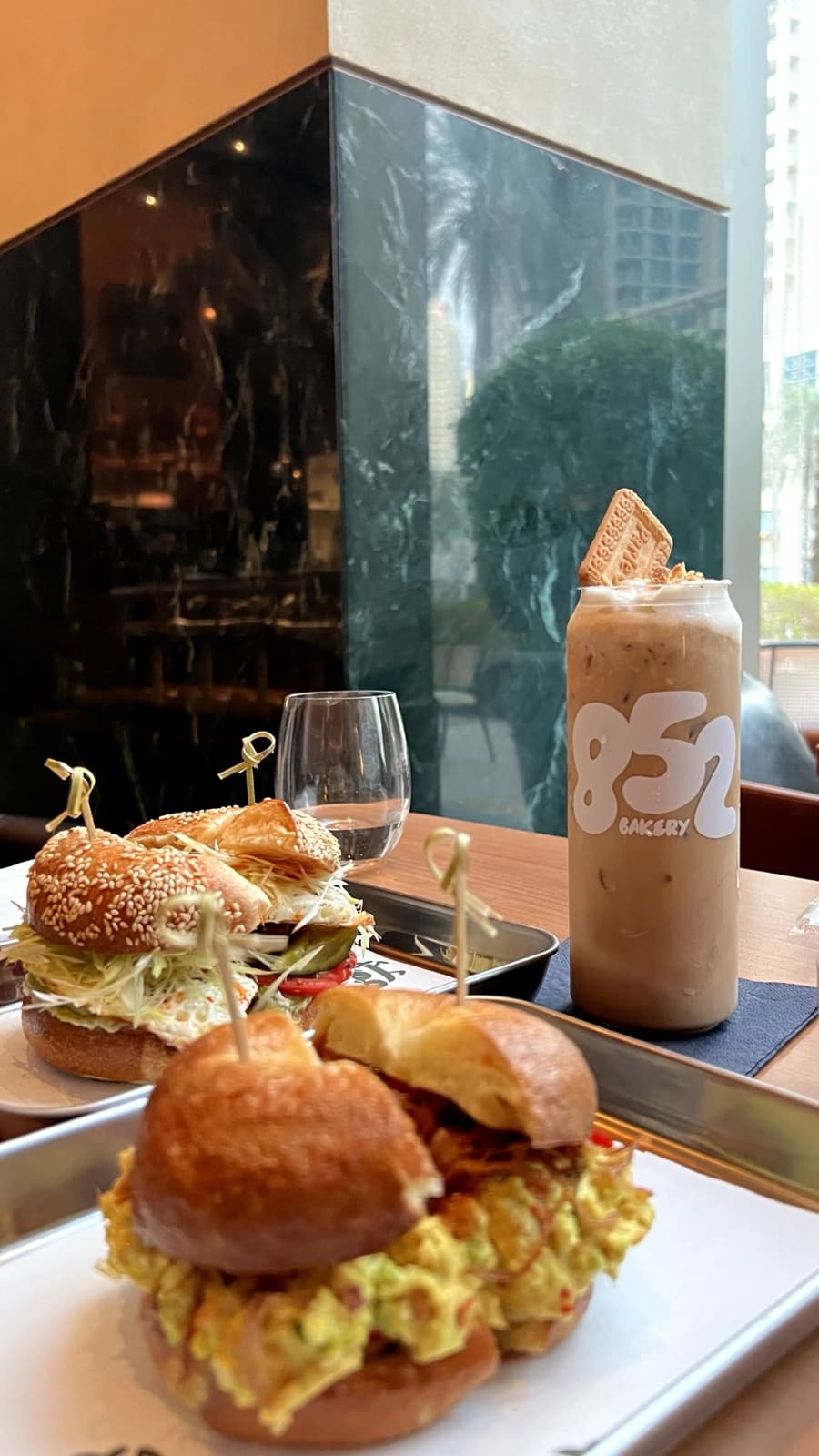 An iced drink and bagel sandwich at 852 x Jun's