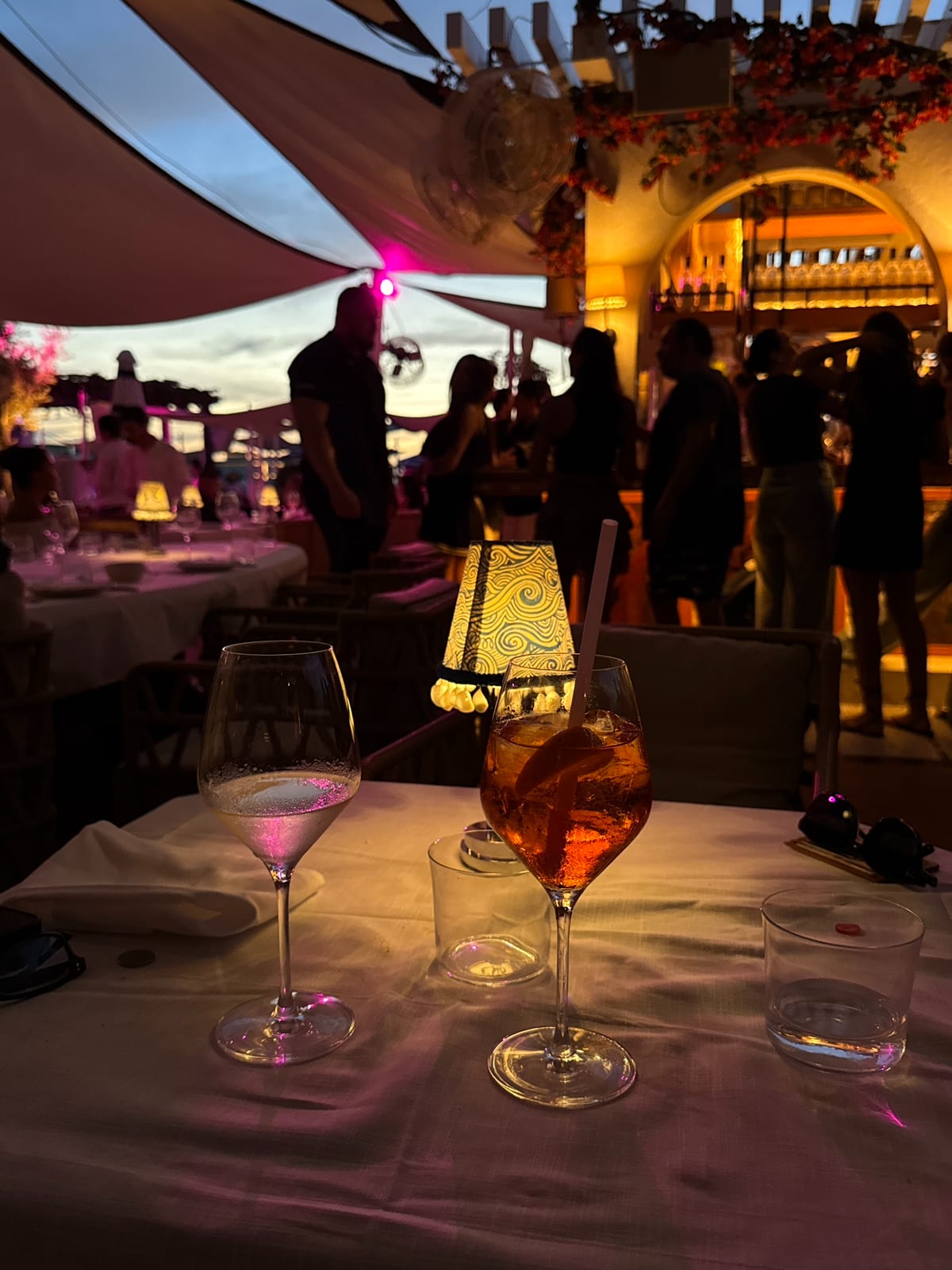 An Aperol spritz and a glass of white at sunset on Sirene’s terrace