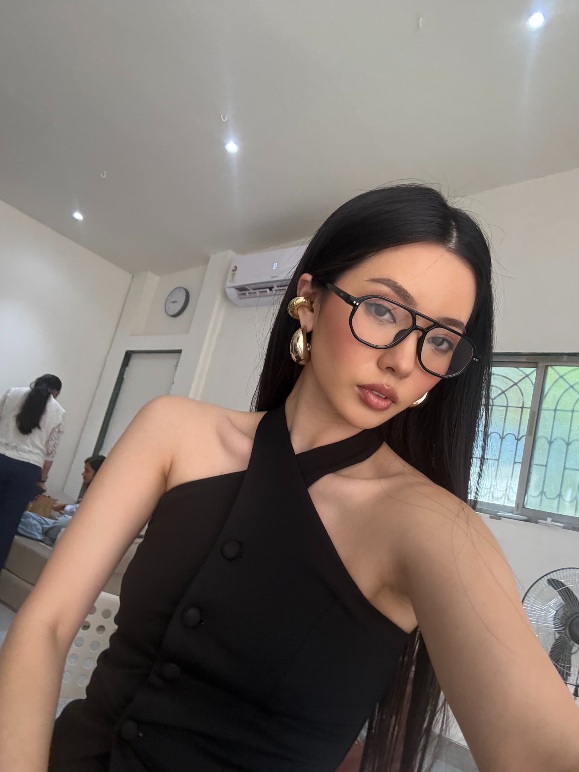 Vailey in aviator glasses and gold hoops