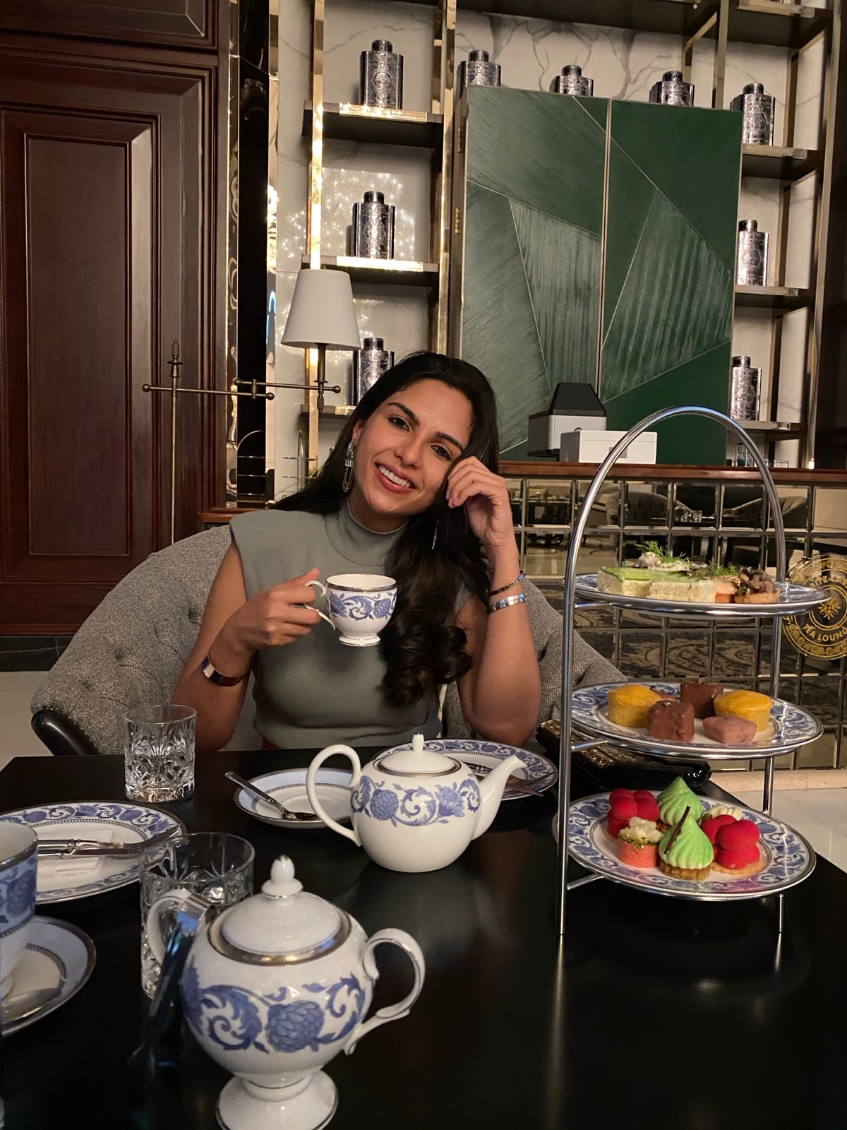Karishma at a coffee table set for two