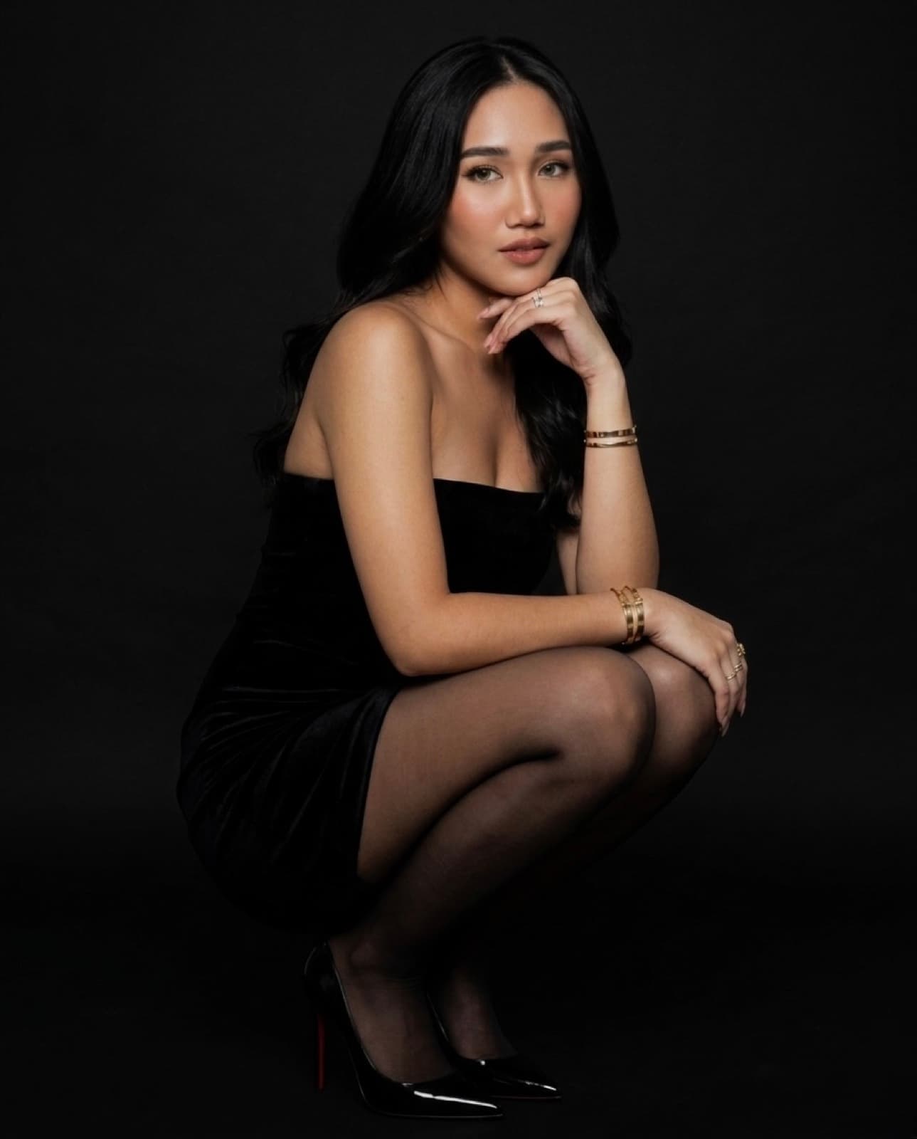 Rhoda in a black dress, studio portrait