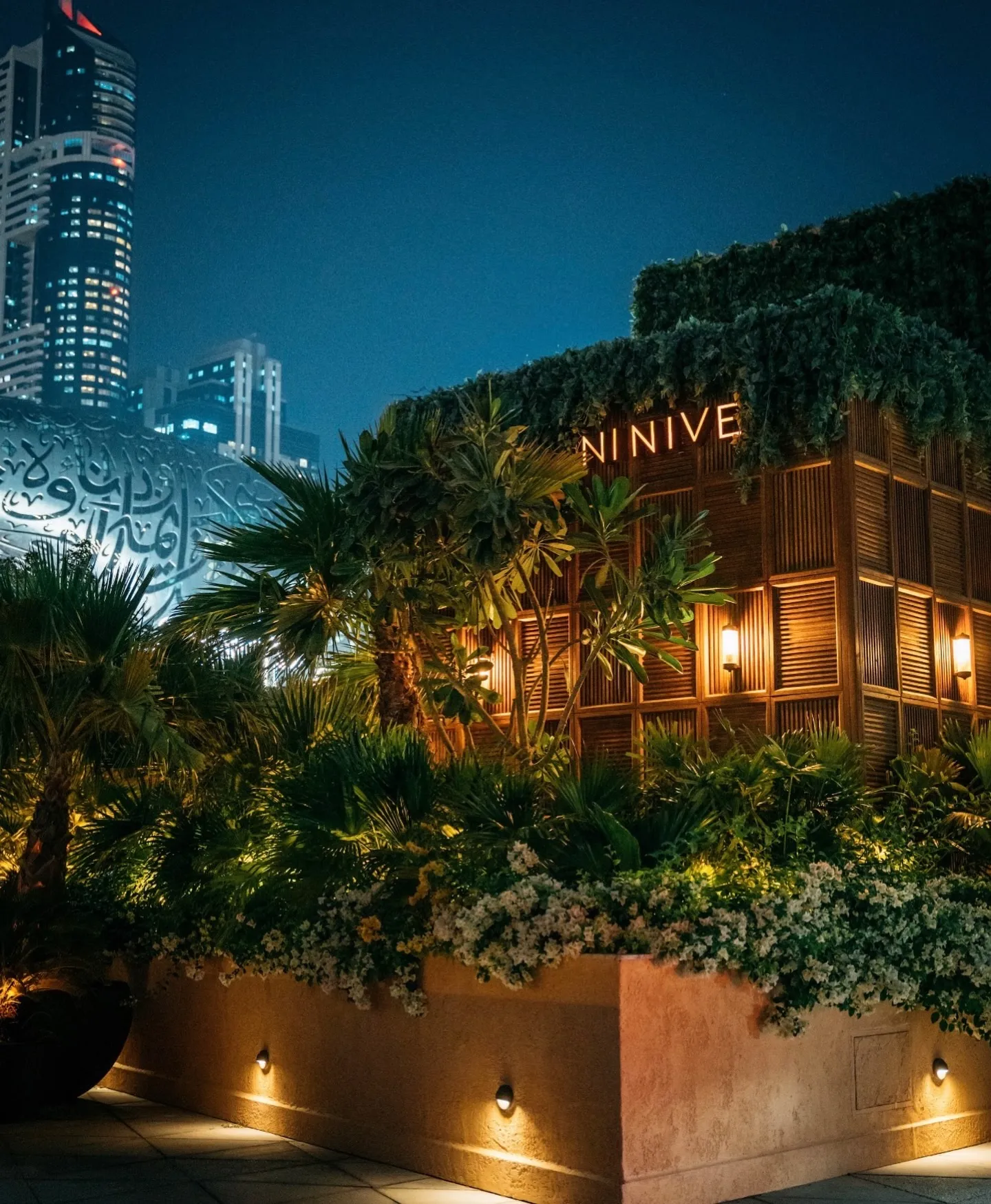 The Ninive sign on its timber pavilion, the Museum of the Future glowing behind