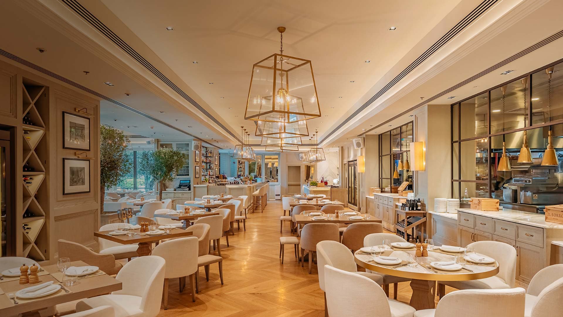 Il Borro’s dining room under brass lanterns