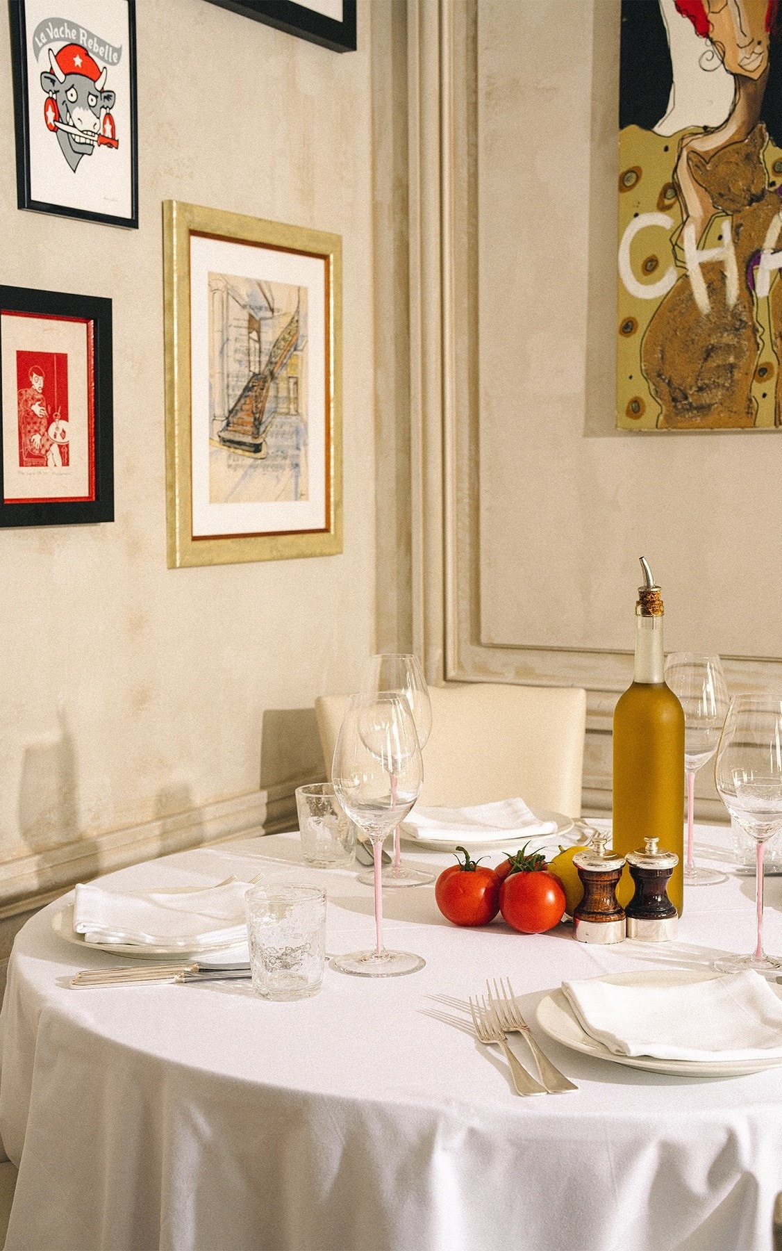 A laid table under framed art at LPM