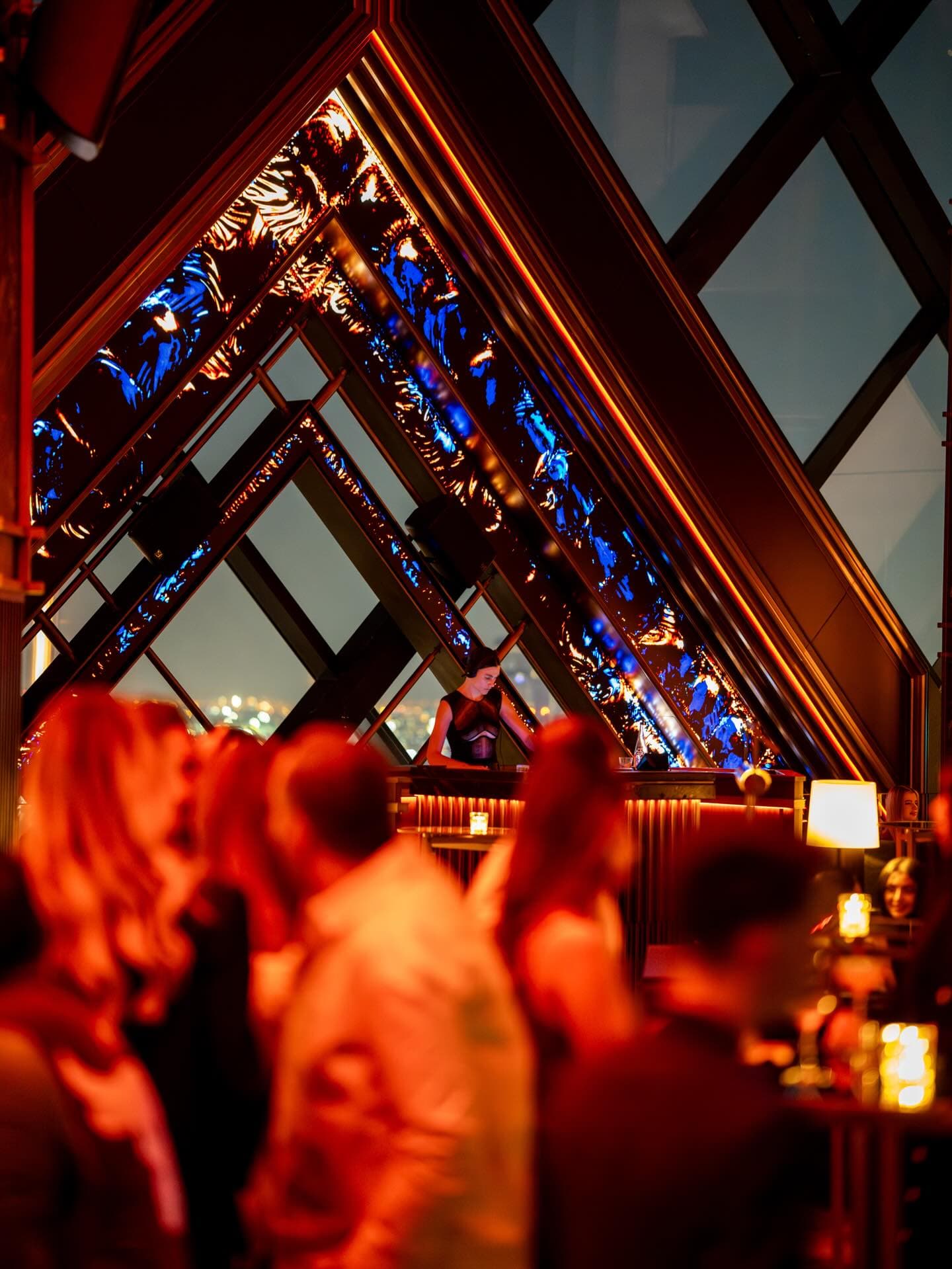 The red-lit lattice dining room at Nobu One Za'abeel
