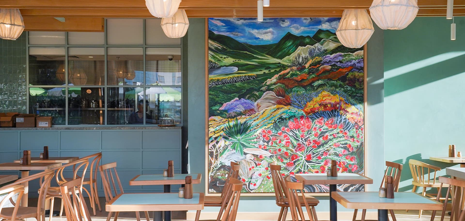 The flower-field mural inside Splendour Fields, JLT