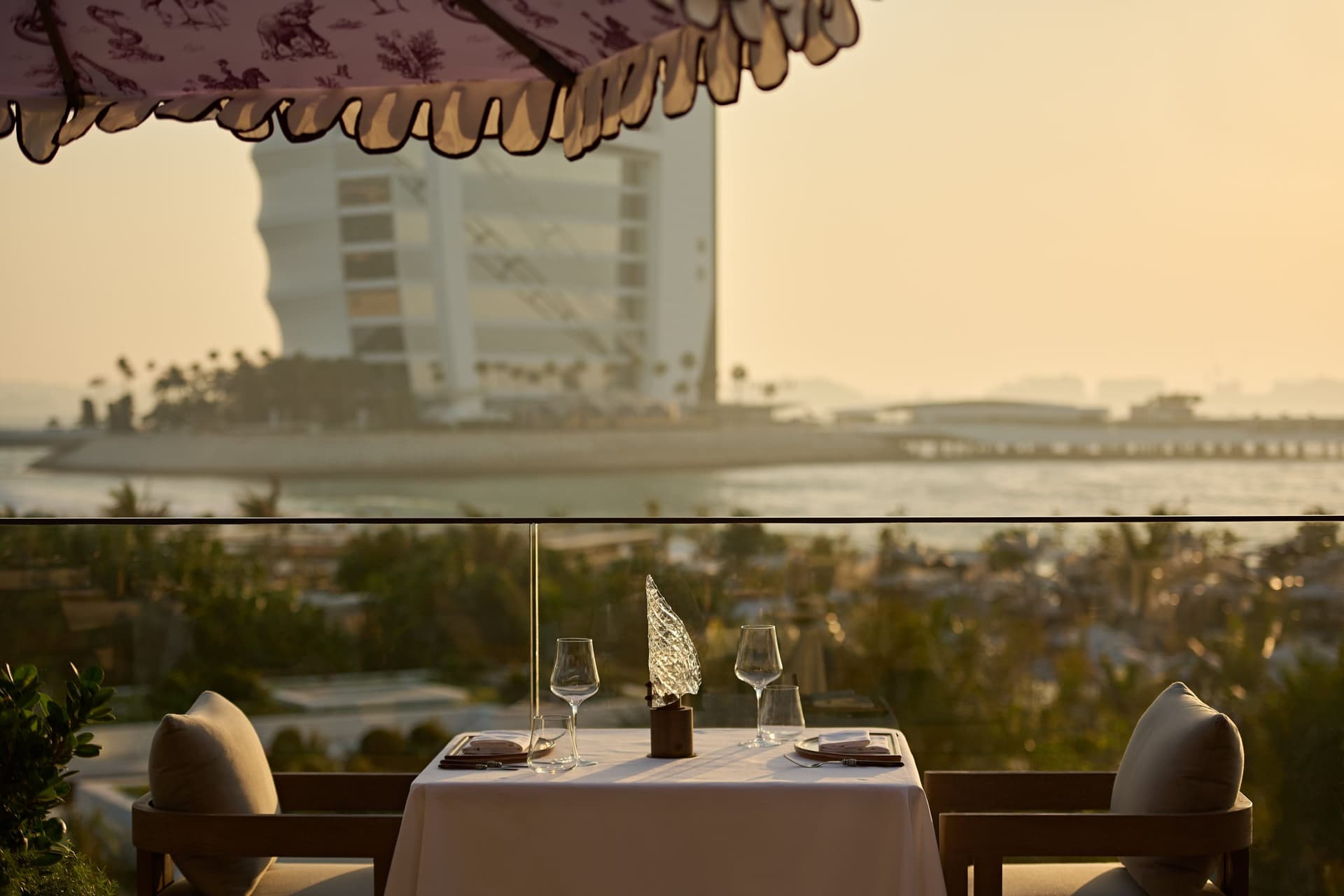 A terrace table facing the Burj Al Arab at The Cullinan