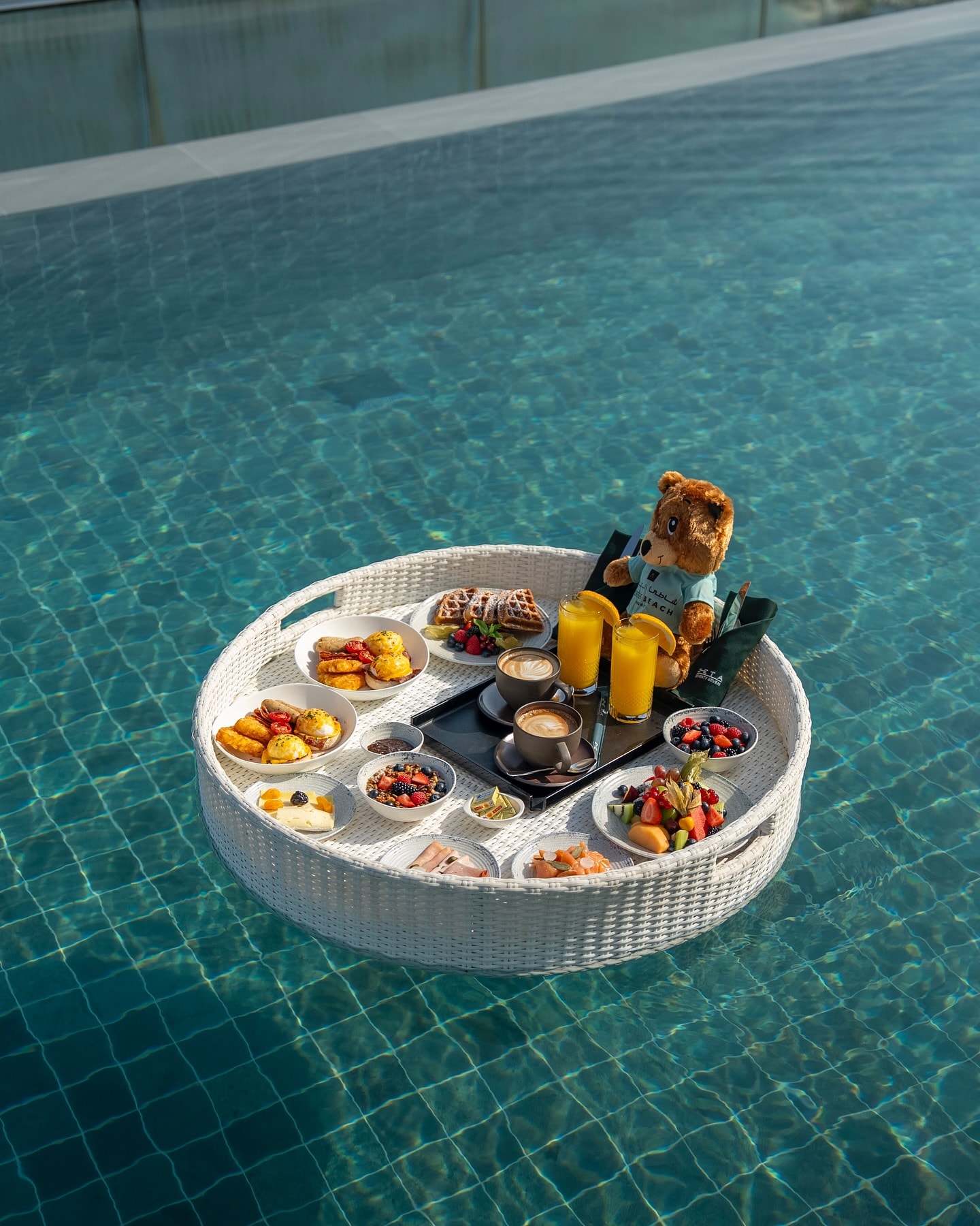 A floating tray in the pool at ZETA Seventy Seven